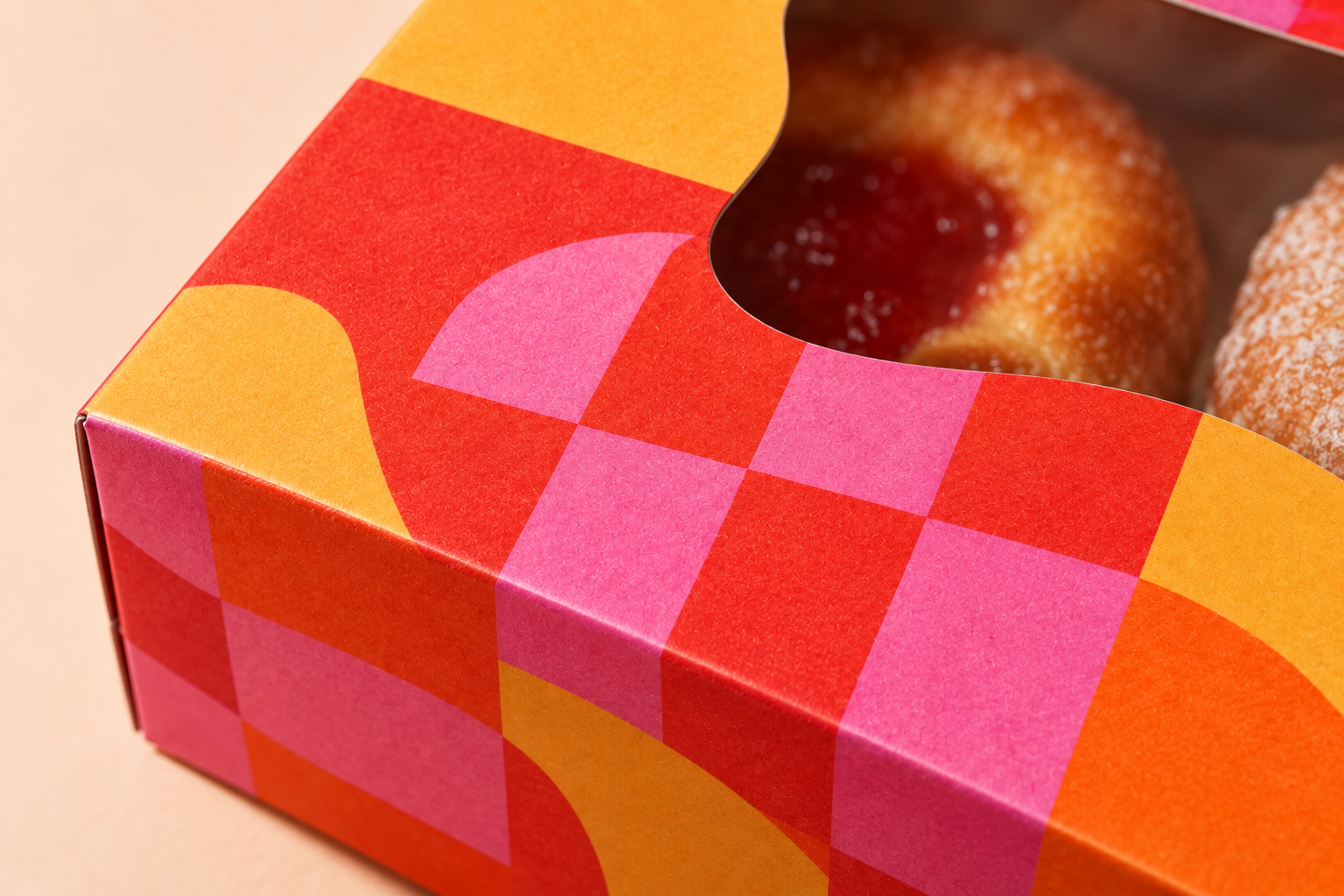 Close view of colourful geometric print and paper folds on the Sweet Disorder carrier