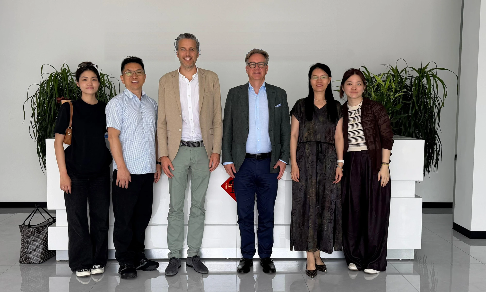 ELMCI's founders with the team at a manufacturing partner in China