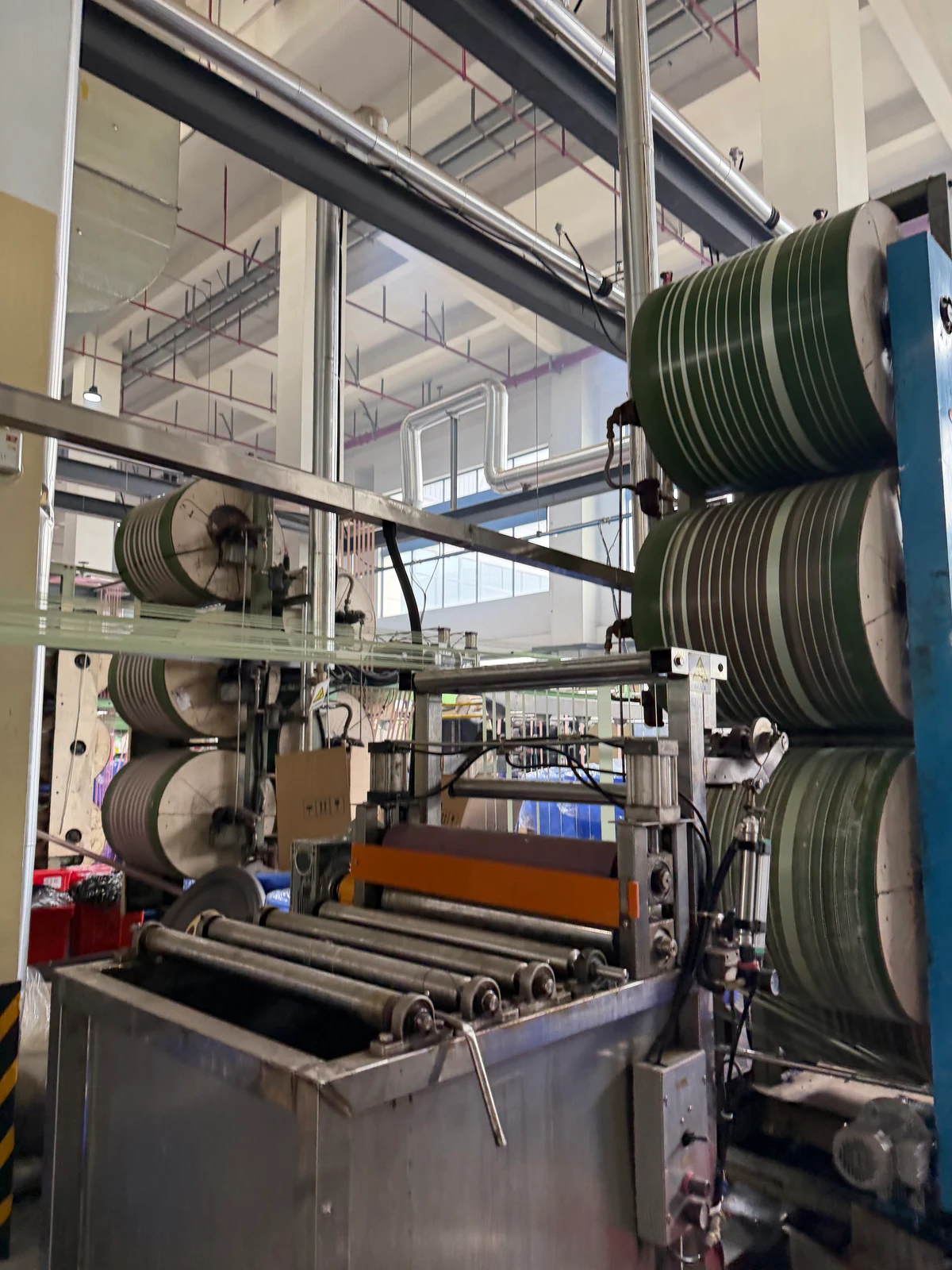 A closer view of production rollers and material photographed during a supplier visit
