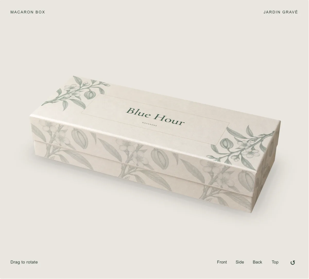 Studio view of a macaron box in the Jardin gravé direction